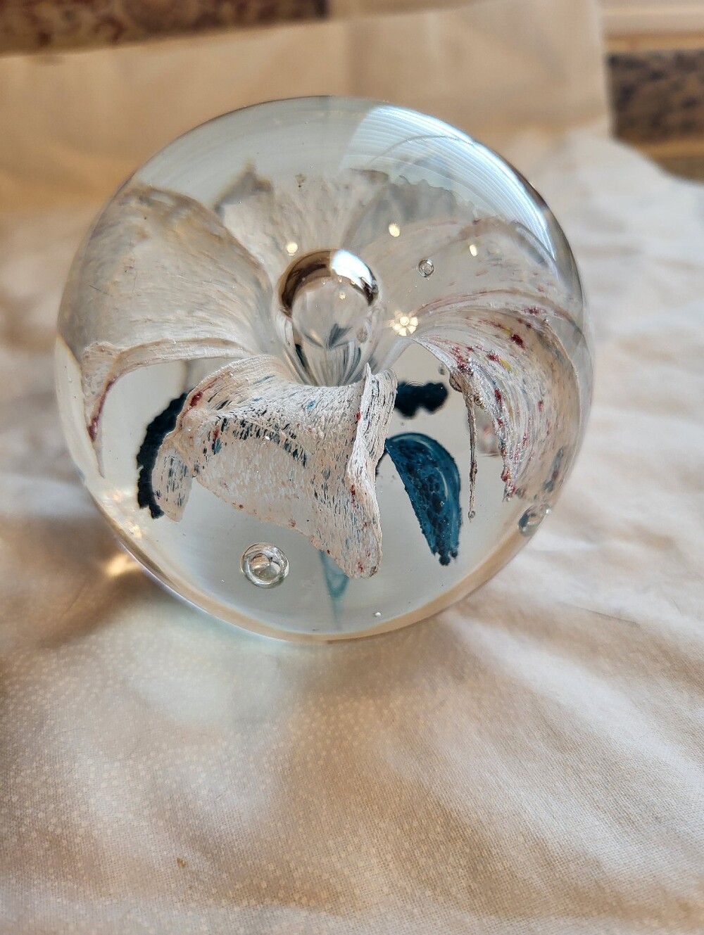 Handblown Glass Art 3 x 3 In. Sphere with White and Teal Floral Core Paperweight - Picture 2 of 10